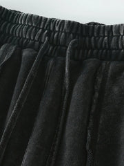Close-up of the elastic waistband and pocket on black shorts