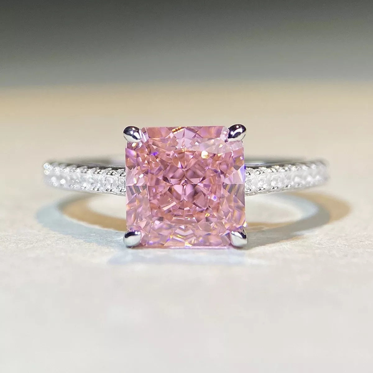 Square pink center stone ring, front view