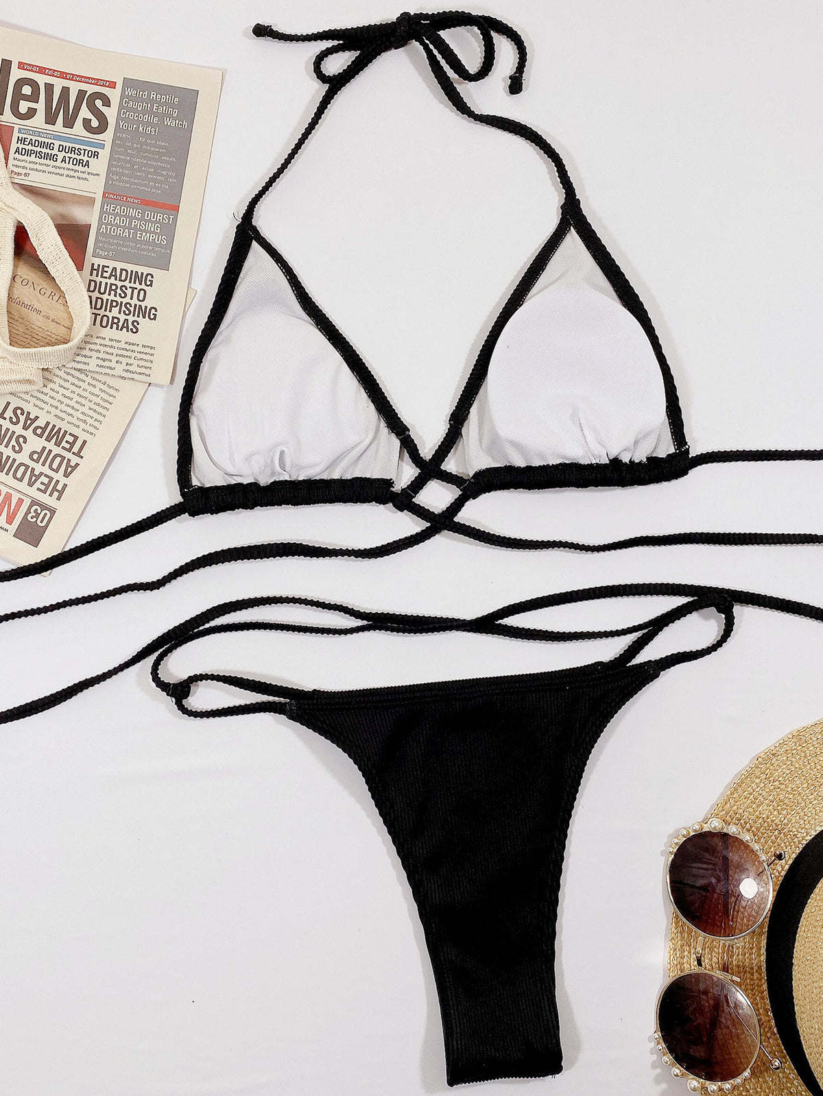 Black crisscross halter bikini set laid flat
