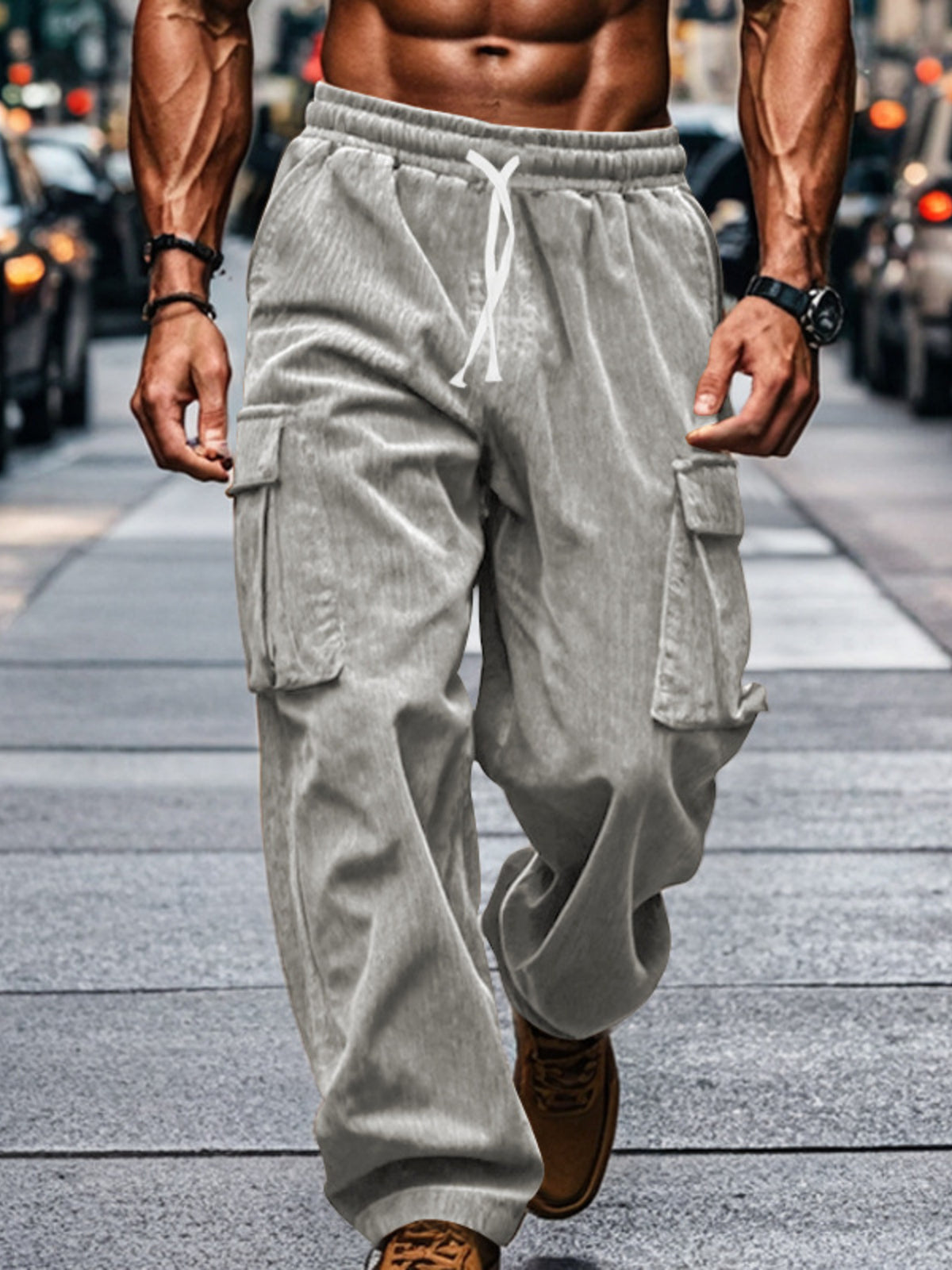 Front view of gray corduroy pants with oversized cargo pockets