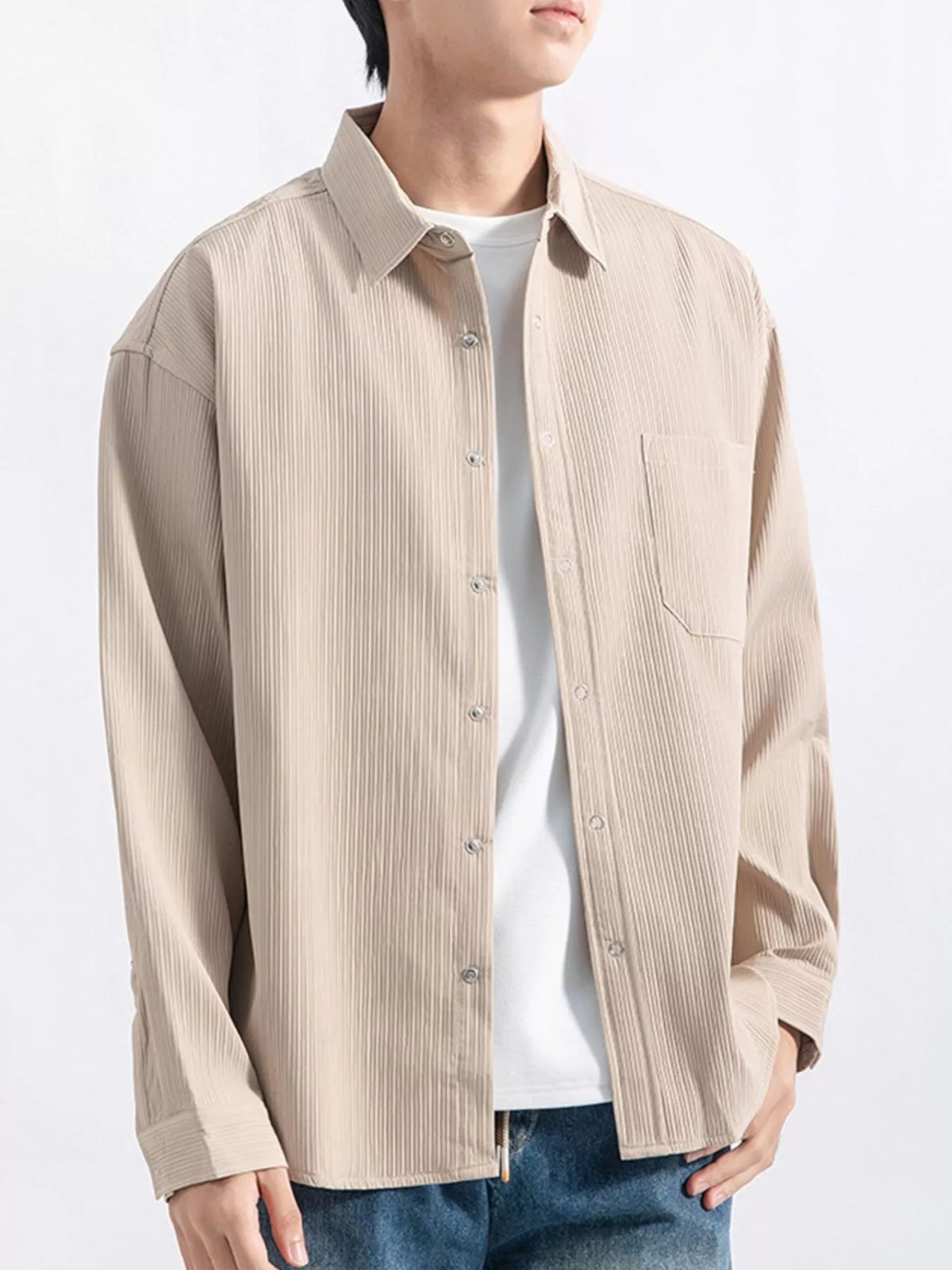 Model shows the relaxed fit and single chest pocket from the front