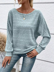 Women’s ribbed round-neck long-sleeve top in light-blue front view with hand at hip