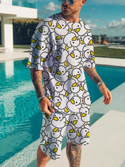 White short-sleeve tee and shorts set with repeating outlined cartoon faces and yellow details.