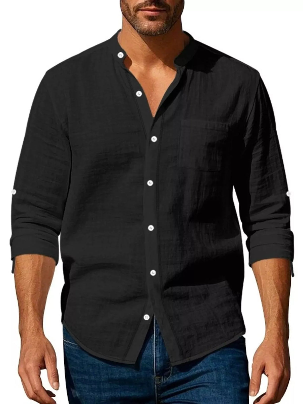 Men’s plus-size black button-up shirt worn with collar open and sleeves rolled