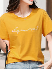 Model wearing the black embroidered script T-shirt, front view