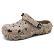Angled view of a khaki printed round-toe clog with open heel