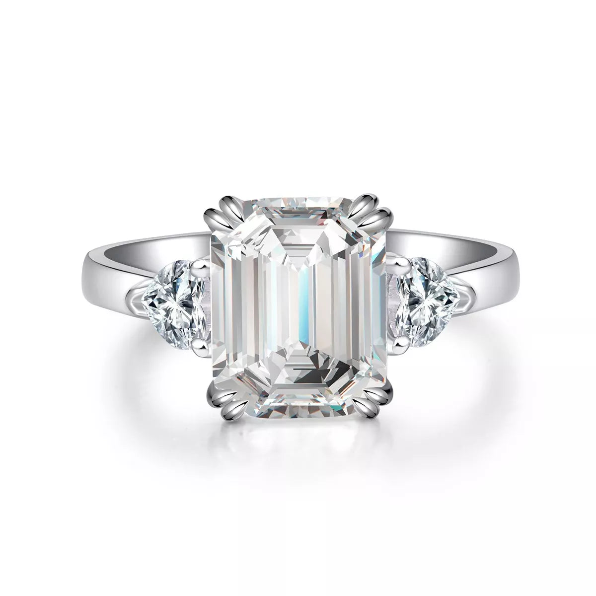 Front view of white-metal ring with emerald-cut clear center stone and two side stones