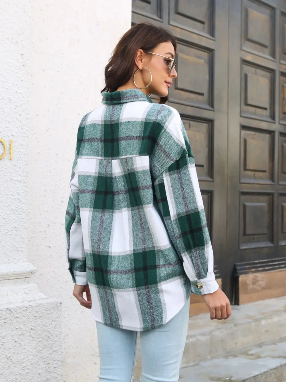 Plaid button-up collared shirt in green-and-white plaid back view