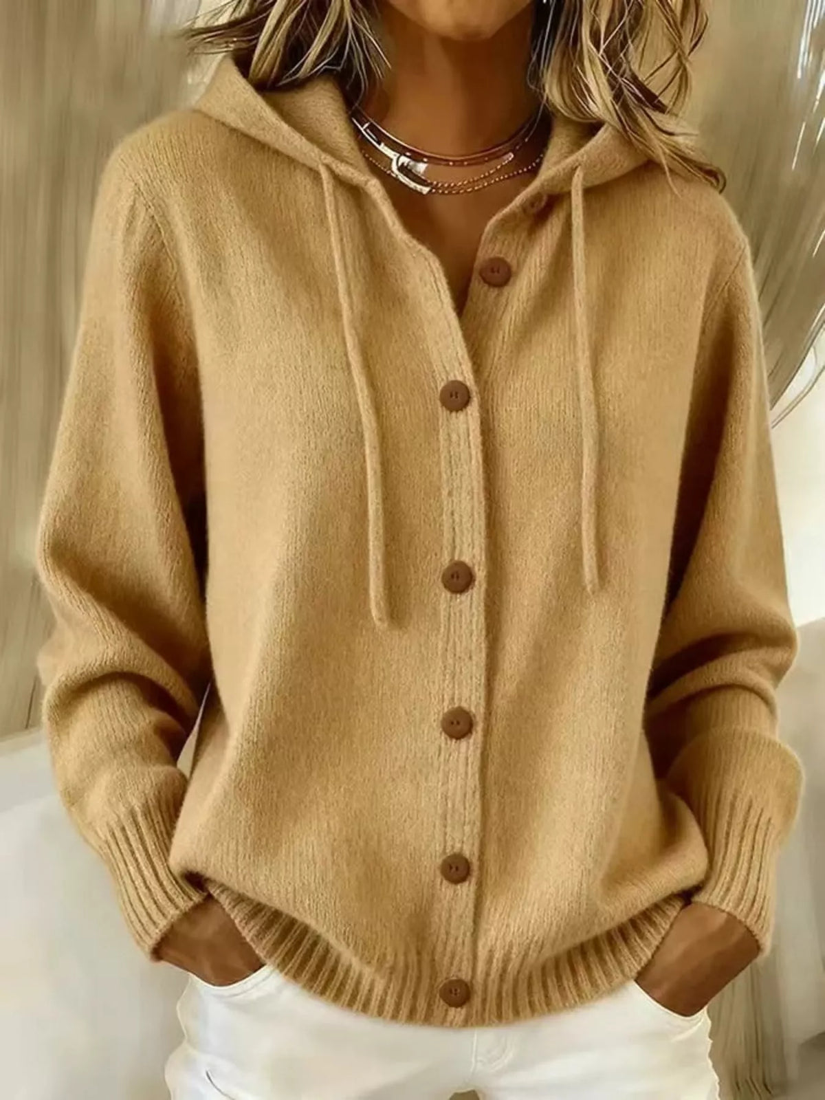 Gray knit cardigan hem with ribbed trim and front pockets