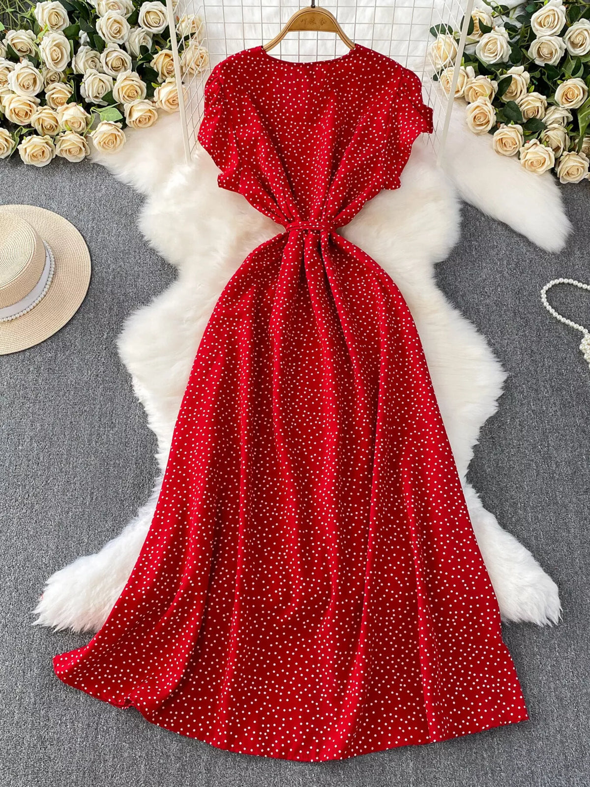 Back view of red polka-dot button-down dress