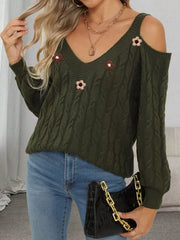 Dark olive cable-knit cold-shoulder sweater with floral appliqués, front view
