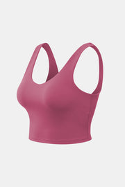 Rose pink cropped scoop-neck active tank shown at a three-quarter angle