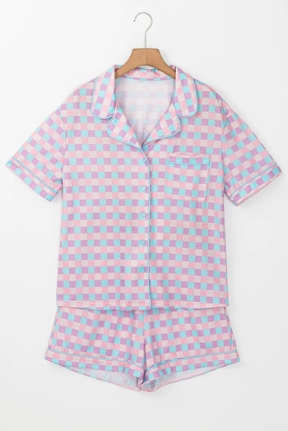 Front view of pink-and-white plaid button-up top and shorts