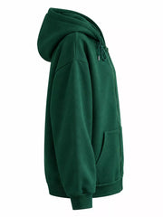 Side view of the dark green hoodie showing the hood and relaxed fit