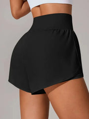 Rear view of black high-waisted shorts with curved wrap overlay