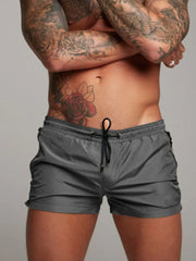 Model wearing gray drawstring active shorts