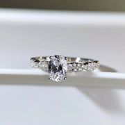 Silver oval ring shown on a hand