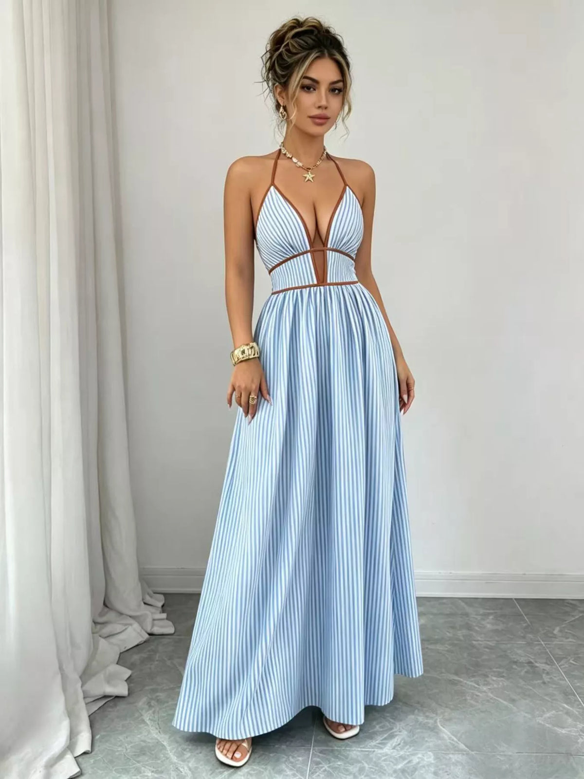 Light blue halter maxi dress with contrasting neckline trim, standing front view