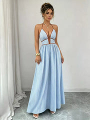 Light blue halter maxi dress with contrasting neckline trim, standing front view