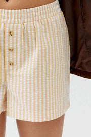 Close-up of cream vertical stripes and leg opening
