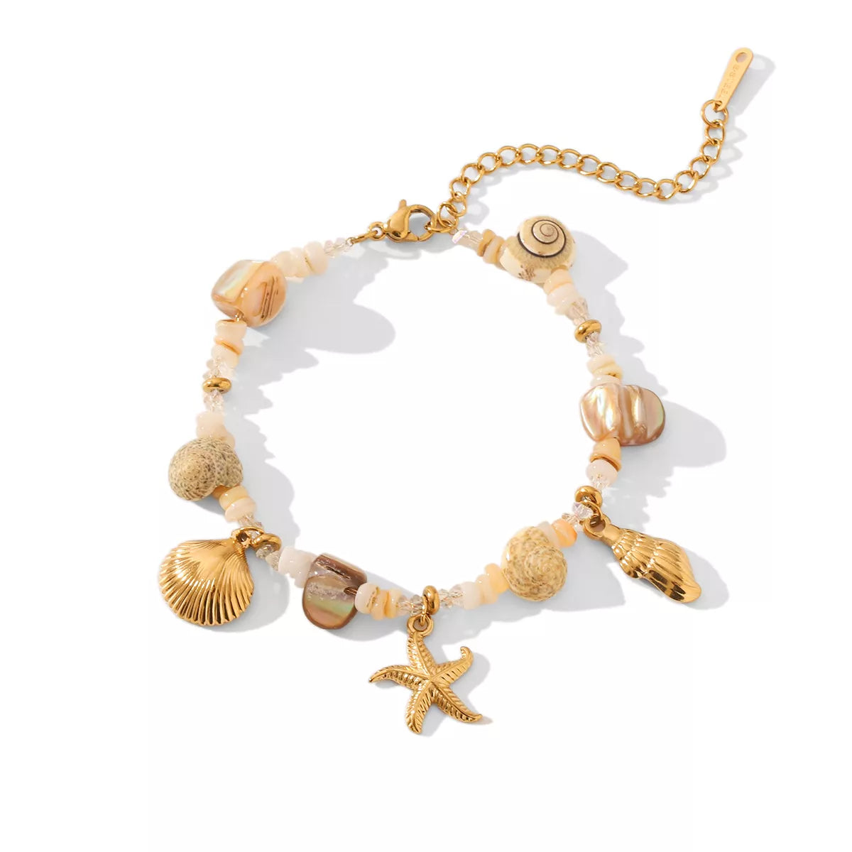 Gold shell bracelet displayed against a light background