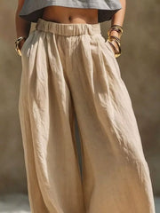 Front view of beige wide-leg pants with gathered waistband and pockets