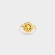 Single gold-tone sunflower ring with a yellow center on white