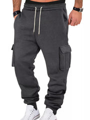 Model wearing charcoal cargo joggers, front view