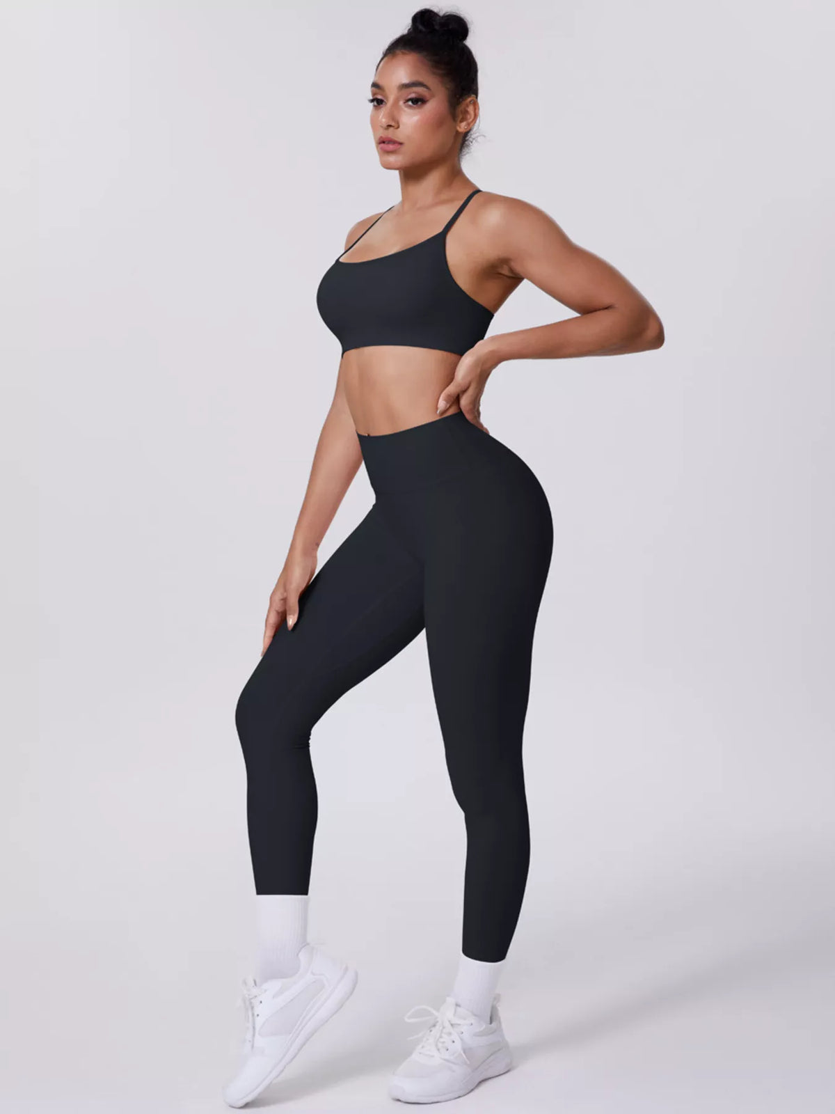Front view showing fit of criss-cross back cami and leggings active set