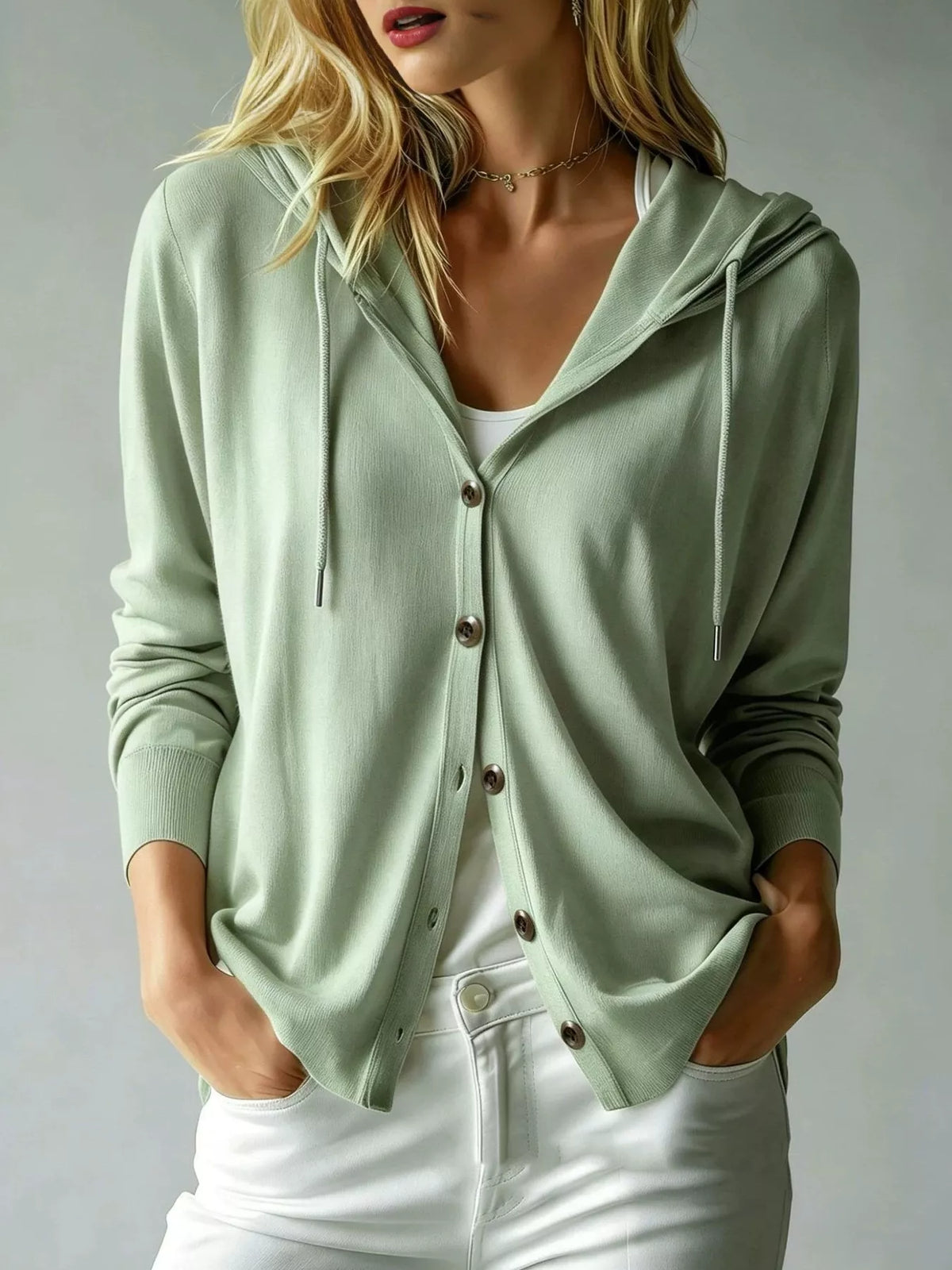 Sage green hooded button-down cardigan with drawstrings, modeled front view