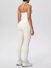 Back view of halter neck cami and high-waisted leggings active set