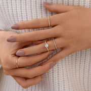 925 sterling silver zircon ring worn with delicate stacking rings