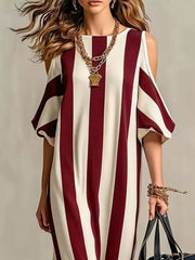 Full-length burgundy striped cold-shoulder dress styled with dark handbag