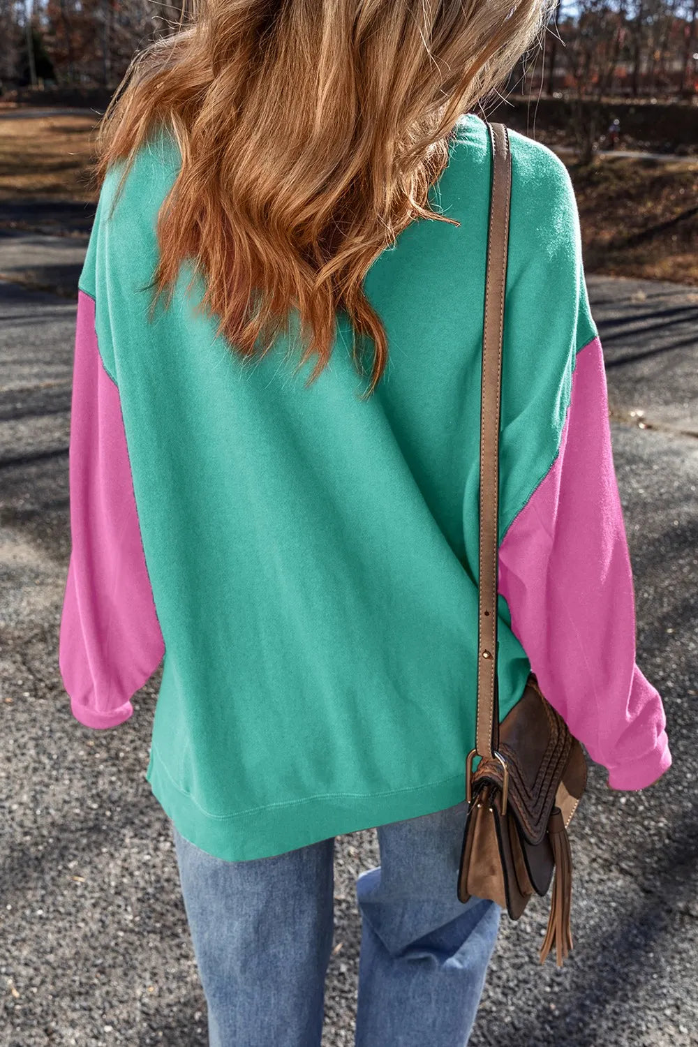 Back view of turquoise contrast-sleeve sweatshirt
