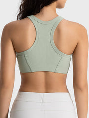 Sage green cropped tank with racerback straps, rear view