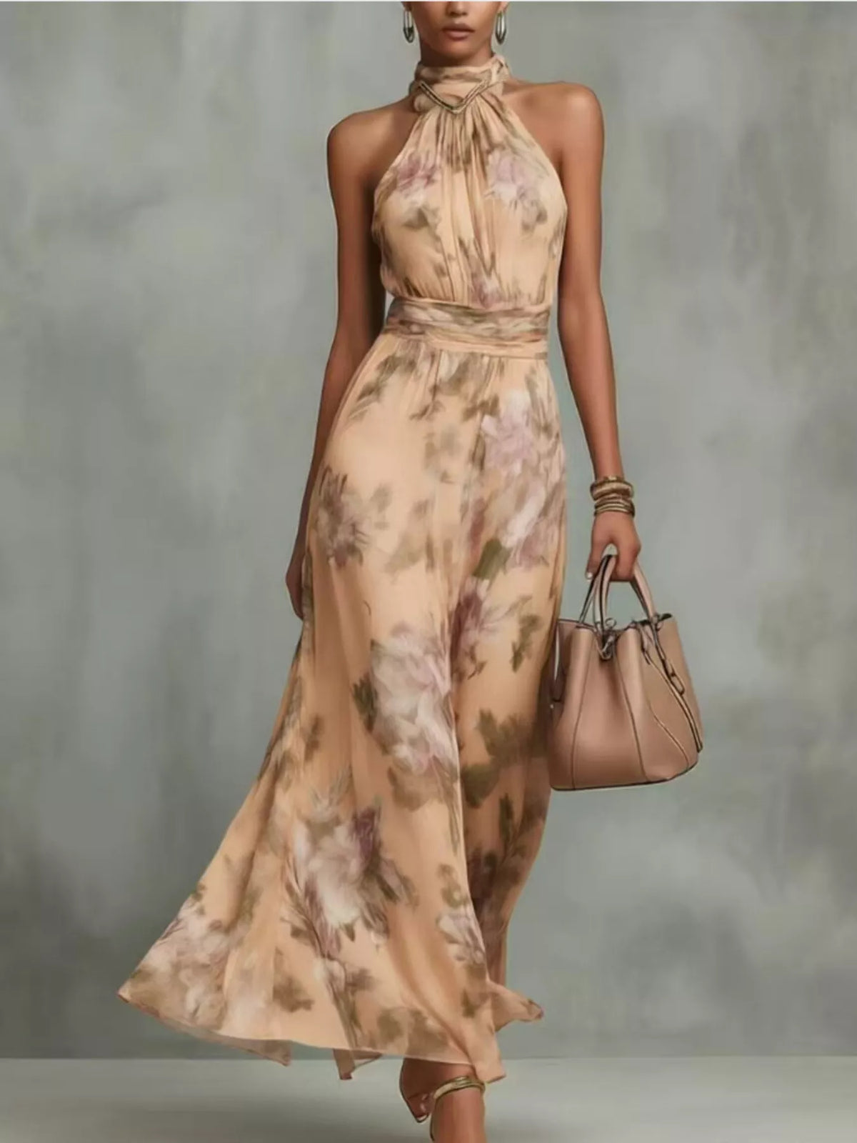 Model wearing a beige floral sleeveless maxi dress with tiered skirt.