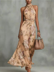Model wearing a beige floral sleeveless maxi dress with tiered skirt.