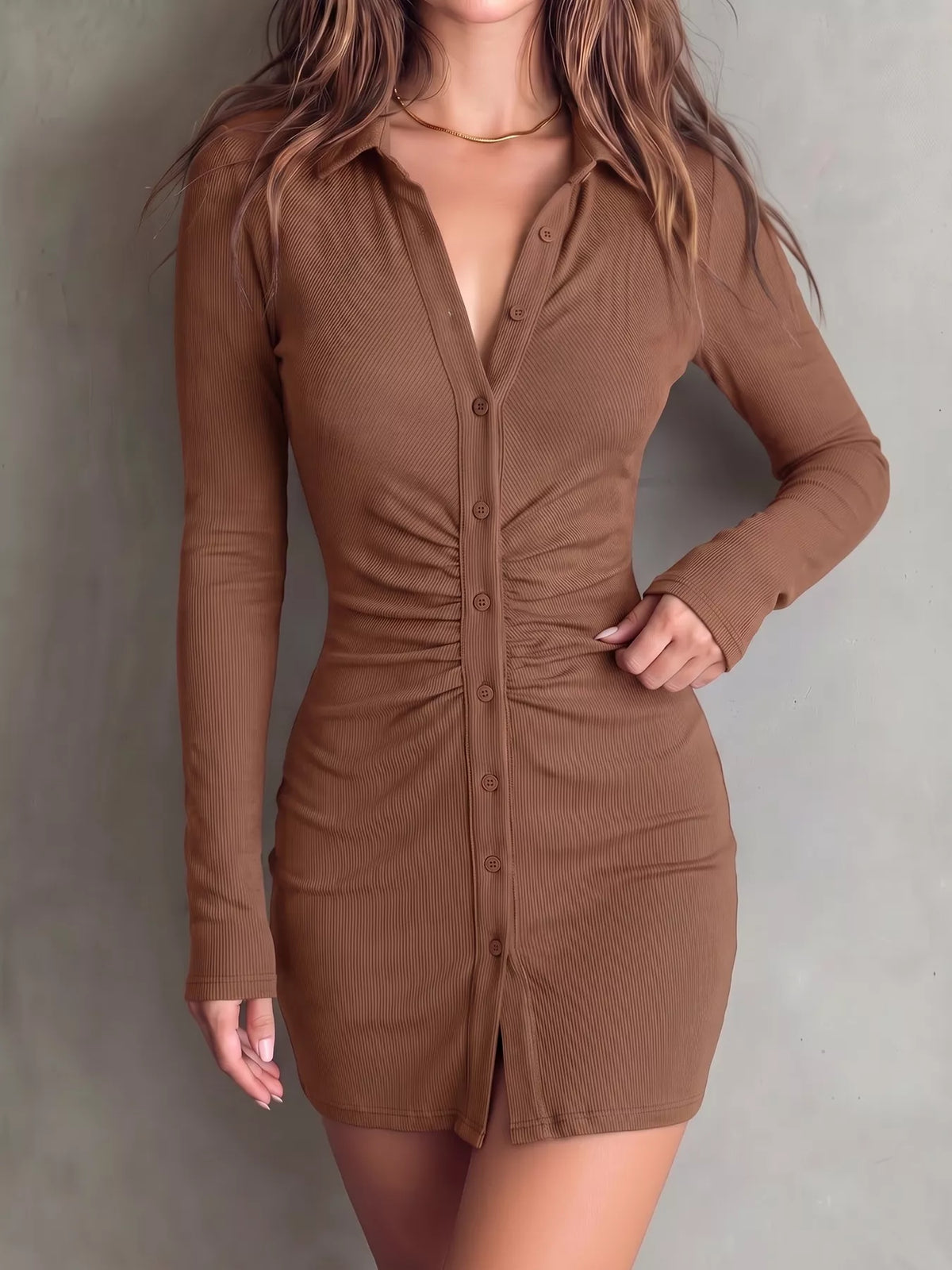 Model poses in brown ruched mini dress with gathered center front.