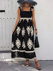 Black and cream printed smocked maxi dress, front view