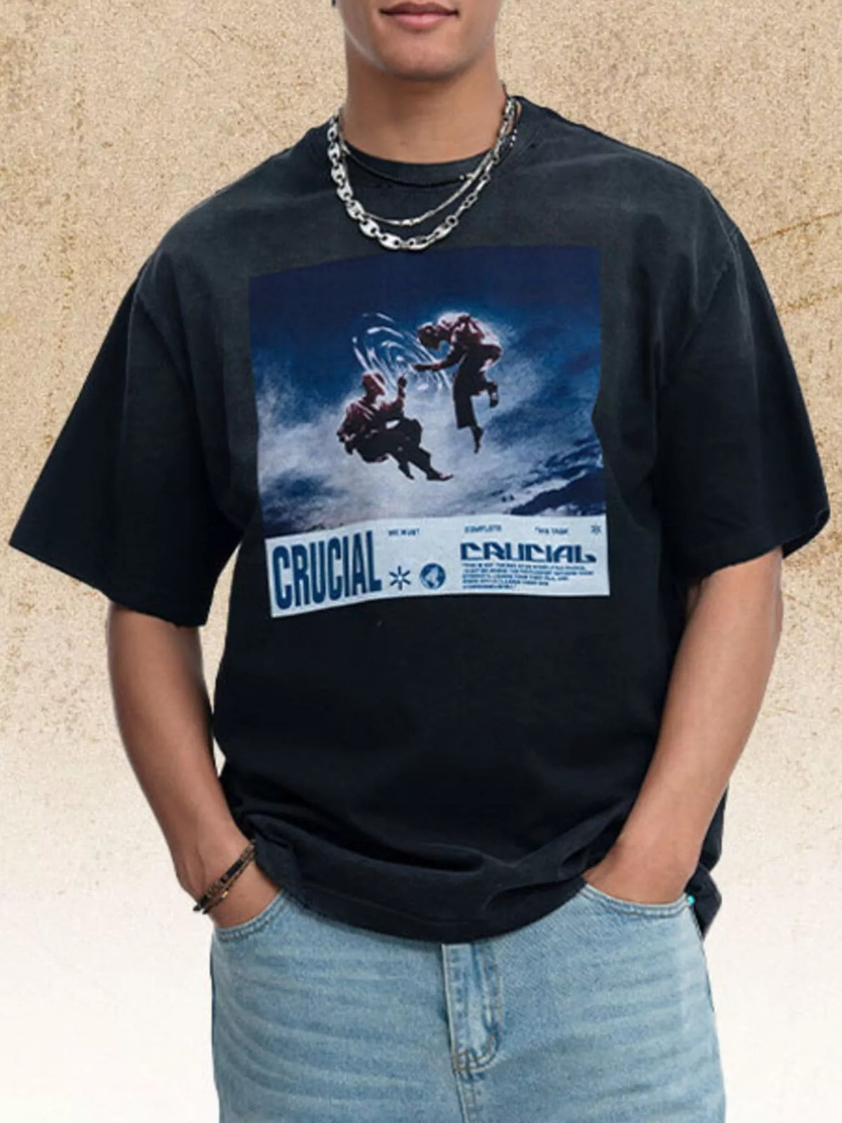 Model wearing black graphic T-shirt, front view
