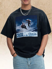 Model wearing black graphic T-shirt, front view