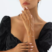 Gold-tone rhinestone hand chain worn from finger to wrist