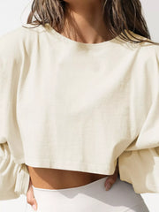 Close-up of cream sweatshirt neckline and cropped front