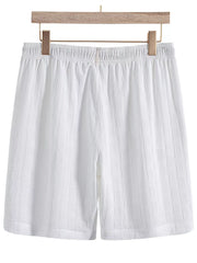 White textured shorts, back view