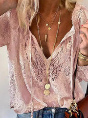 Pink lace blouse shown on model, highlighting loose sleeves and front tie