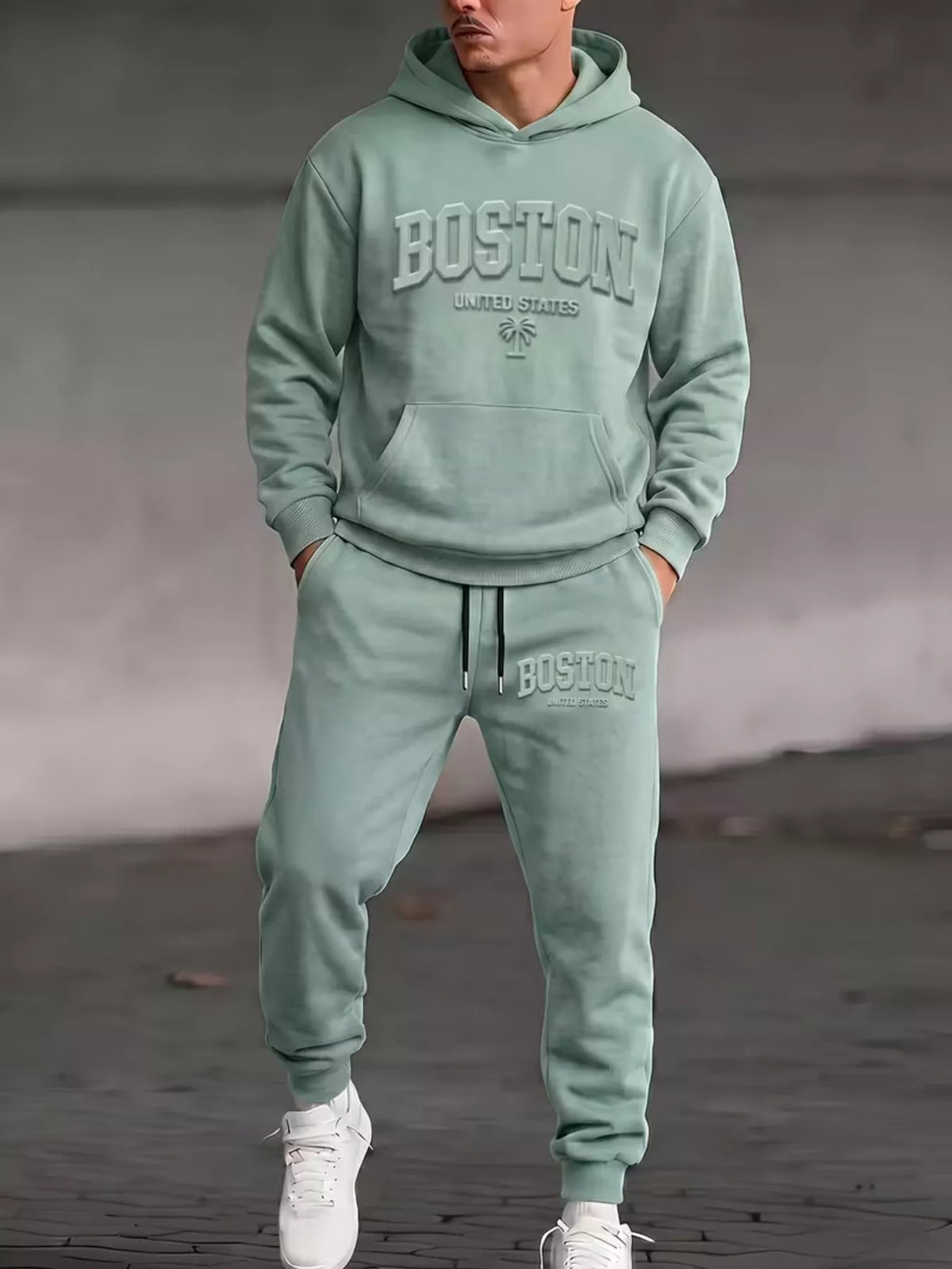 Model wearing sage Boston hoodie and matching joggers