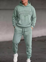Model wearing sage Boston hoodie and matching joggers