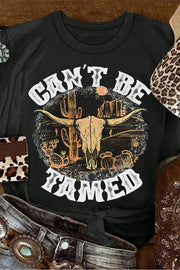 Close-up of Cant Be Tamed graphic on black T-shirt