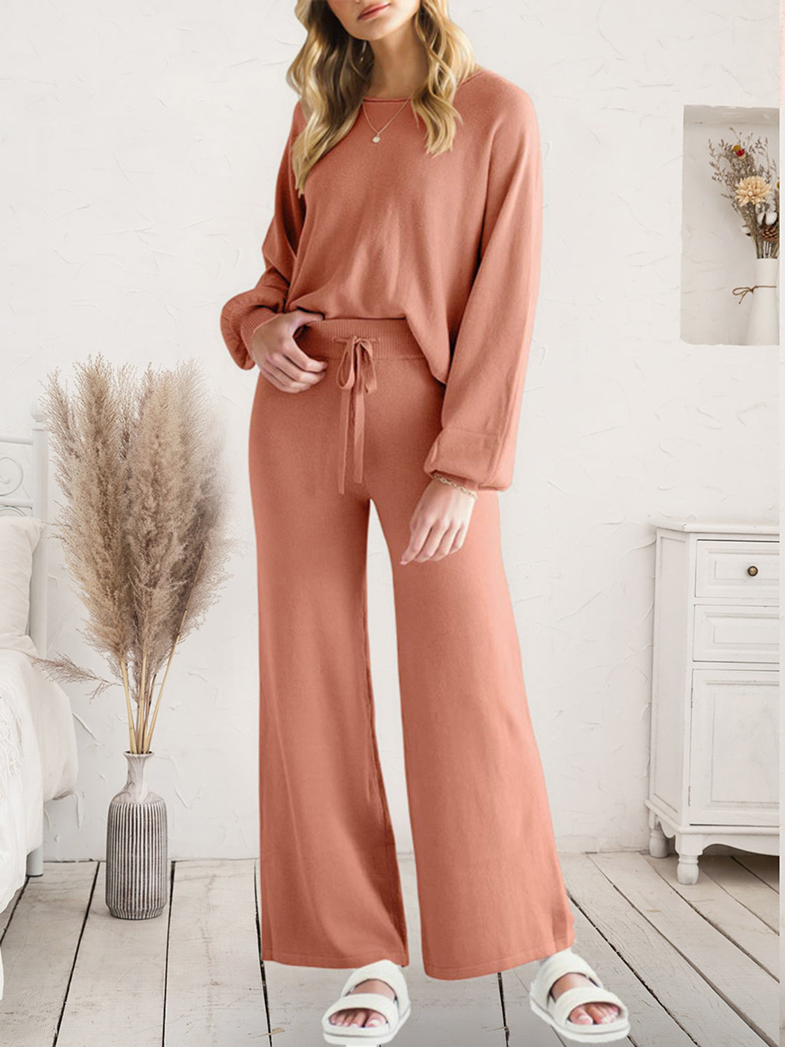 Full-length view of rust-colored V-neck lounge top and matching pants
