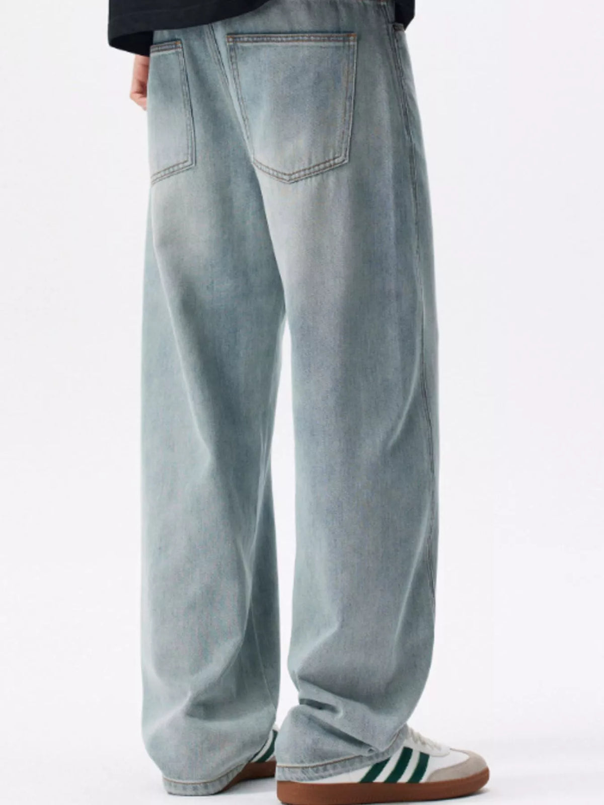 Back view of light blue loose-fit jeans